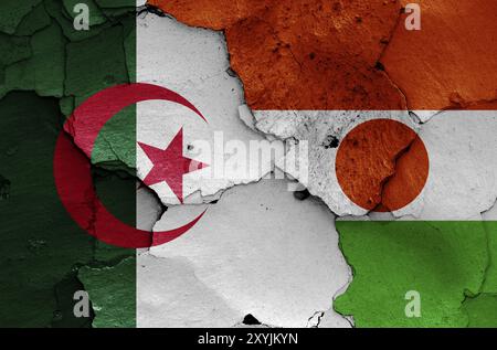 Flaggen von Algerien und Niger auf gerissene Wand gemalt Stockfoto