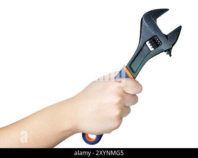 Hand, die einen britischen Schraubenschlüssel auf weißem Hintergrund Stockfoto