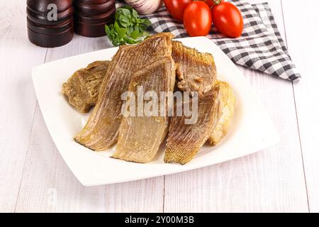 Gebackene Stachelrochen mit Öl und Gewürzen Stockfoto