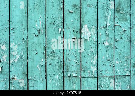 Alte Bretter mit gerissener Cyan-Farbe. Strukturierter alter hölzerner Hintergrund mit vertikalen Linien. Cyan Holzdielen für Ihr Design. Grün-blau oft Schmerzen Stockfoto