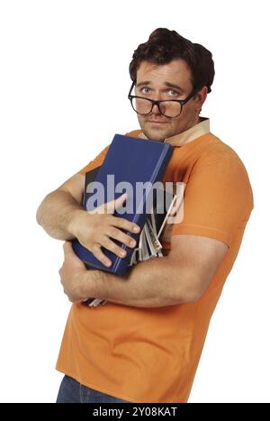 Junger Mann in Gläser halten Haufen Bücher Stockfoto