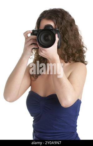 Frau mit einer SLR-Kamera, immer bereit, zu fotografieren, isoliert in weiß Stockfoto