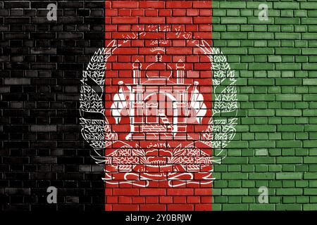 Flagge Afghanistans auf Ziegelmauer gemalt Stockfoto