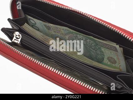 Paket mit polnischen 100 Zloty Notes auf brauner Lederbörse Stockfoto