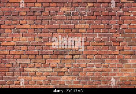 Foto einer alten verwitterten Ziegelwand, eines Hintergrunds oder einer Textur. Stockfoto