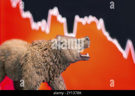 Stock Crash mit rotem Diagramm im Hintergrund und Bär vorne. Bärenmarkttrend-Konzept Stockfoto