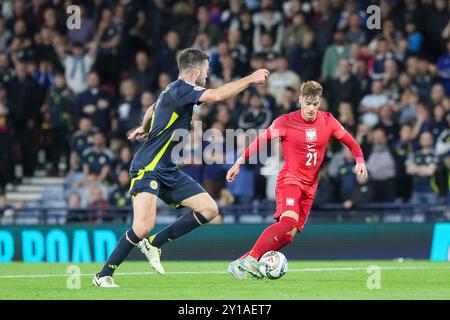 Glasgow, Großbritannien. September 2024. Schottland spielte Polen im Hampden Park, Glasgow, Schottland, Großbritannien, im ersten Spiel der UEFA Nations League 2024. Das Ergebnis war Schottland 2:3, Polen. Die Tore wurden von B. Gilmour (46 Minuten), S, McTominay (76 Minuten) und für Polen (8 Minuten), S. Szymański (8 Minuten), R. Lewandowski (44 Minuten) und N. Zalewski (90 Minuten) erzielt. Quelle: Findlay/Alamy Live News Stockfoto