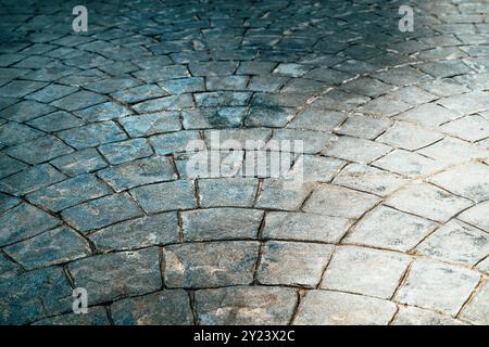 Pflastersteinpflastermuster in abnehmender Perspektive als Hintergrund Stockfoto