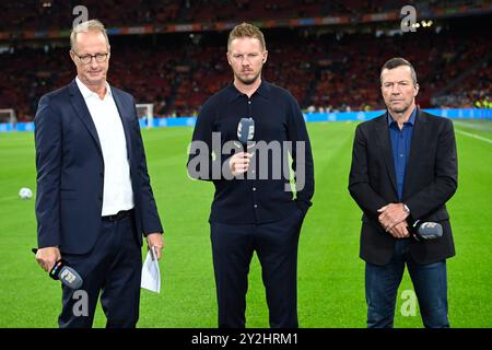 Von links: RTL-Moderator Florian KOENIG, Nationaltrainer Julian NAGELSMANN (GER), Lothar MATTHAEUS. Football Nations League Niederlande (NED) - Deutschland (GER) am 10.09.2024 in der Amsterdam Arena/Johan Cruyff Arena in Amsterdam/Niederlande Stockfoto