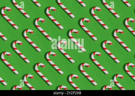 Nahtloses Muster von Zuckerstangen auf grünem Hintergrund. Weihnachtshintergrund. 3D-Abbildung. Stockfoto
