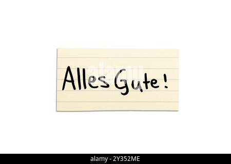 Alles Gute! Deutsches Wunschwort zur Kommunion auf beigefarbenem Papier, handgeschrieben. Isoliert auf weiß. Freier Platz für Text. Stockfoto