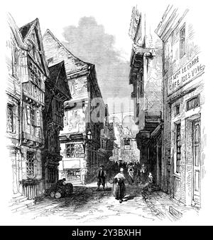 Straße in Morlaix, Bretagne, 1871. "Der kleine Seehafen von Morlaix, im Departement Finisterre, wird... eine sehr gute Vorstellung der bretonischen Architektur geben, wie auch der Gewohnheiten und der Erscheinung der einfachen Bauernschaft... Morlaix besitzt den dauerhaften Charme der Lage, der glücklicherweise nicht modernisiert oder auf das utilitaristische Muster reduziert werden kann. In einem Tal gelegen, stützen sich die beiden Seiten auf den felsigen Hügeln, die ihren Hintergrund bilden, oder heben sich mit Terrassengärten auf die Höhen ab, die auf die Stadt blicken. Die Häuser sind, wie die Gravur zeigt, mit Projektin gebaut Stockfoto