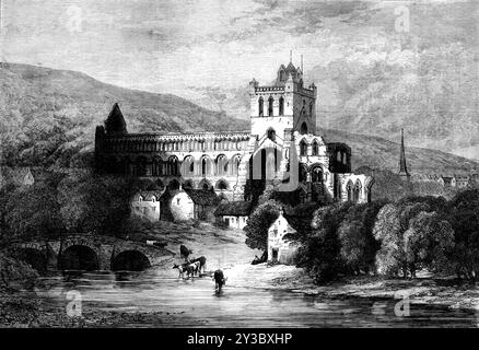 The Scott Centenary: Jedburgh Abbey, 1871. "Jedburgh Abbey verdankte seine architektonische Pracht der Schirmherrschaft des schottischen Königs David I., der im 12. Jahrhundert regierte und riesige Summen für Kirchengebäude ausgab... aber die Gründung von Jedburgh ist um zwei oder drei Jahrhunderte älter als die von Dryburgh und Melrose, denn St. Kenoch war Abt von Jedburgh im Jahr 1000... die Abtei wurde in den Kriegen mit den einfallenden Engländern, angeführt von Edward und Eduard III. und wieder durch die Armee des Earl of Surrey in der Zeit Heinrichs VIII. wurden seine Mauern BA Stockfoto