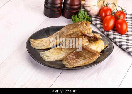 Gebackene Stachelrochen mit Öl und Gewürzen Stockfoto