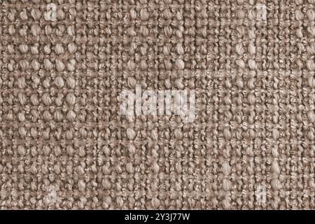 Textur von braunem Jacquard-Gewebe aus rauem Gewebe, Stoffstrukturhintergrund, Nahaufnahme, Makro. Material für Heimtextilien, Polster und Vorhangdekor, Stockfoto