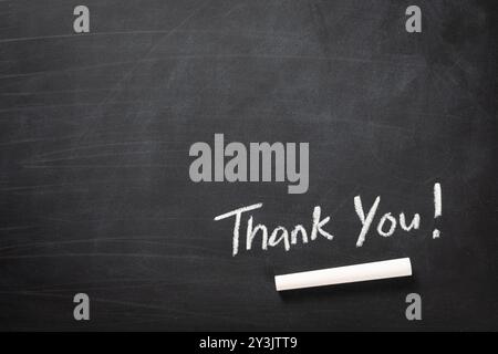 Handschrift Danke Wort auf Tafel Stockfoto