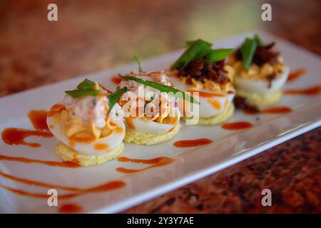 Gourmet-Eier, Meeresfrüchte und Speck Stockfoto