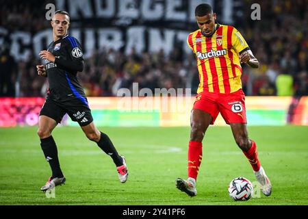 Maxence CAQUERET von Lyon und Andy DIOUF von Lens während des französischen Meisterschaftsspiels Ligue 1 zwischen RC Lens und Olympique Lyonnais am 15. September 2024 im Bollaert-Delelis-Stadion in Lens, Frankreich Stockfoto