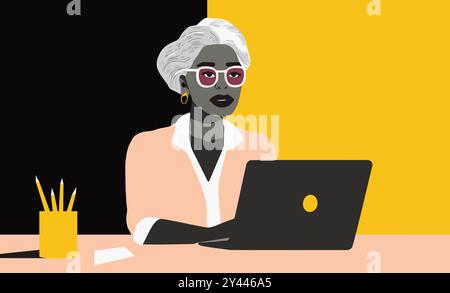 Eine Frau sitzt an einem Schreibtisch mit einem Laptop vor sich Stockfoto