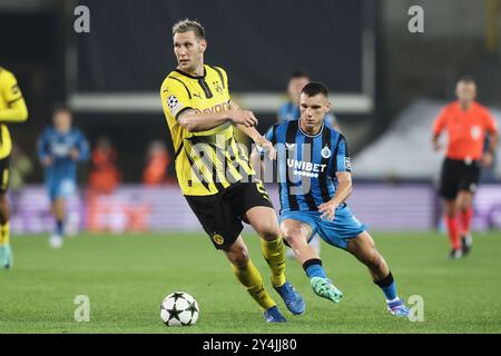 Brügge, Belgien. September 2024. Borussias Niklas Sule und Ferran Jutgla kämpfen um den Ball während eines Fußballspiels zwischen dem belgischen Club Brugge KV und der Deutschen Borussia Dortmund am Mittwoch, den 18. September 2024, in Brügge, am ersten Tag der UEFA Champions League-Phase. BELGA FOTO BRUNO FAHY Credit: Belga News Agency/Alamy Live News Stockfoto