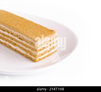 Napoleon schneidet Kuchen aus Blätterteig mit Sahne Stockfoto