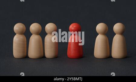 Holzfigur, die mit dem Team steht, um Einfluss und Befähigung zu zeigen. Konzept der Unternehmensführung für das Führungsteam, erfolgreicher Wettbewerbssieger und Stockfoto