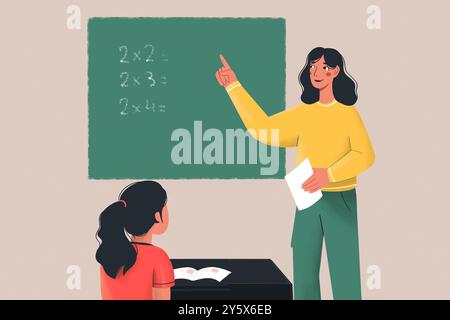 Ein lächelnder Lehrer steht neben einer Tafel mit Multiplikationsproblemen, zeigt nach oben, während ein Schüler, der an einem Schreibtisch sitzt, aufmerksam zusieht. Stockfoto