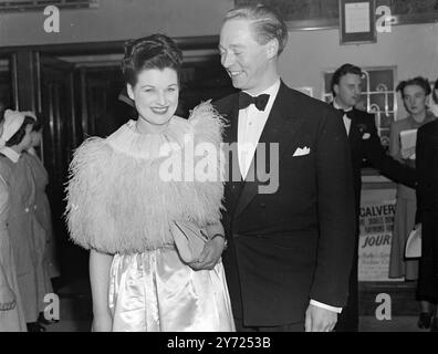 Herr J. Arthur Ranks neuer Film „Broken Journey“ hat heute Abend seine Premiere im Gaumont Theatre, Haymarket, London, zugunsten der Mothercraft Training Society, von der H. Die Königin ist Patronin. Miss Phyllis Calvert hat die Hauptrolle in dem neuen Film. Die Fotos zeigen: Miss May Shannon, eine Userin im Glasgow Cinema, nimmt als Teil des Preises für den Gewinn des britischen „Cover Girl“-Wettbewerbs von Gaumont am Premier Teil. Sie ist mit der Filmstar Jumiie Hanley bei der Premiere heute Abend (Montag) im Gaumont Theatre in London zu sehen. April 1948 Stockfoto