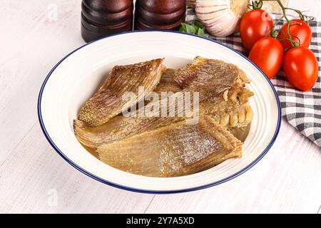 Gebackene Stachelrochen mit Öl und Gewürzen Stockfoto