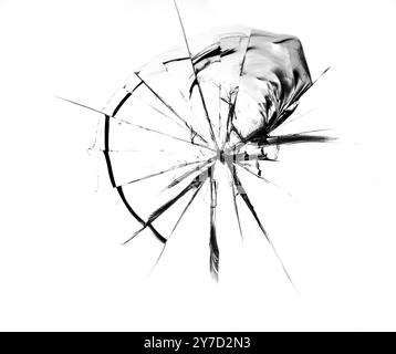 Rissmuster auf gebrochenem Glas, Abstraktion von Spänen und Linien vom Aufprall auf Glas Stockfoto
