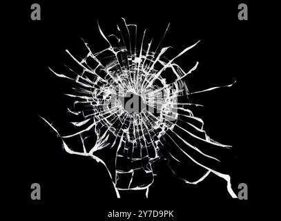 Zerbrochenes schwarzes Glas. Struktur von Rissen auf dem Fenster Stockfoto