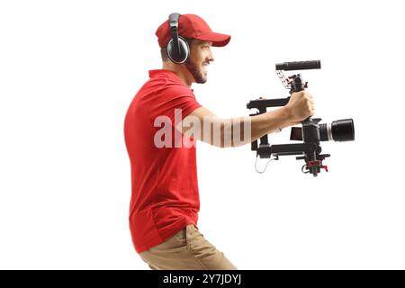 Kamerabediener verwendet einen Stabilisator und isoliert auf weißem Hintergrund Stockfoto