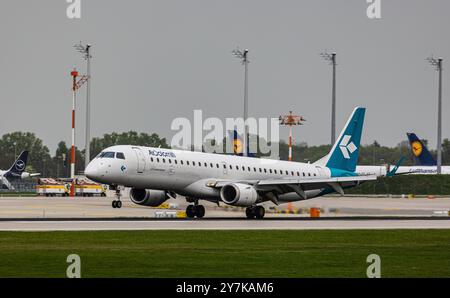 München, 9. April 2024: Ein Embraer 195LR aus AirDolomiti landet auf der Landebahn am Flughafen München. Registrierung I-ADJK. (Foto: Andreas Haas/di Stockfoto