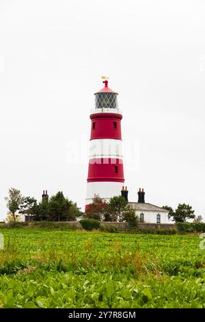 Rot-weißer Leuchtturm in Happisburgh, Norfolk, England. Stockfoto