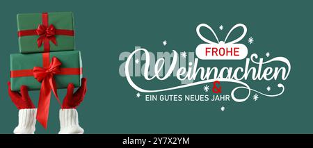 Grußkarte mit Text FROHE WEIHNACHTEN ein GUTES NEUES JAHR und Händen mit Geschenken Stockfoto