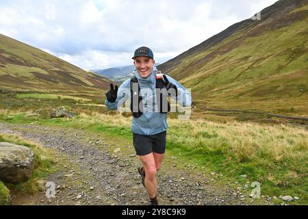 Trailläufer, die an 13 Valleys Ultra Marathon, Lake District, Cumbria, Großbritannien teilnehmen Stockfoto