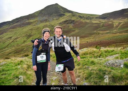 Trailläufer, die an 13 Valleys Ultra Marathon, Lake District, Cumbria, Großbritannien teilnehmen Stockfoto