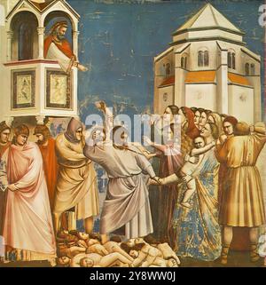 GIOTTO di Bondone (* 1267, Vespignano, d. 1337, Firenze) Nr. 21 Szenen aus dem Leben Christi: 5. Massaker der Unschuldigen 1304-06 Fresko, 200 x 185 cm Cappella Scrovegni (Arena Kapelle), Padua das Massaker der Unschuldigen ist die einzige Szene in der Kapelle, in der zwei Gebäude erscheinen. Die achteckige Struktur auf der rechten Seite erinnert an ein Taufhaus (eine Anspielung auf die Bluttaufe dieser unglücklichen Säuglinge?) und wird noch deutlicher dargestellt als die Strukturen in Assisi. Man fühlt, dass es sich um ein echtes Gebäude handelt, ein Effekt, der durch die subtile Unterscheidung zwischen dem verstärkt wird Stockfoto