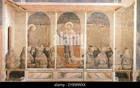 GIOTTO di Bondone (* 1267, Vespignano, d. 1337, Florenz) Szenen aus dem Leben des Heiligen Franziskus: 3. Erscheinung in Arles 1325 Fresco, 280 x 450 cm Bardi Kapelle, Santa Croce, Florenz dem Zyklus des Heiligen Franziskus in der Bardi Kapelle fehlt die Lebendigkeit seines Assisi-Gegenstücks und vermittelt den Eindruck, in der Zeit durch einen Vorhang der Heiligkeit von uns getrennt zu sein. Dennoch wurden bestimmte Merkmale, wie die Figur des Heiligen Antonius in der Erscheinung von Arles, eindeutig vom Assisi-Zyklus inspiriert. Wir bemerken die ausgewogene Zusammensetzung der Erscheinung in Arles, die durch Geräte su nicht monoton ist Stockfoto