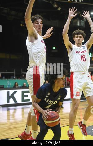 Olivier Rioux und Spencer Ahrens (Kanada) verteidigen gegen Christopher Brown (USA). FIBA Basketball Americup U18 - Buenos Aires 2024 Stockfoto