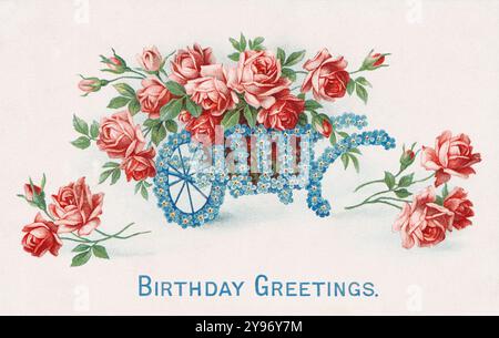 Eine Vintage-Postkarte aus der Edwardian Ära Birthday Greetings, die 1907 veröffentlicht wurde und eine Schubkarre zeigt, die mit Vergissmeinnots und rosa Rosen bestückt ist. Stockfoto