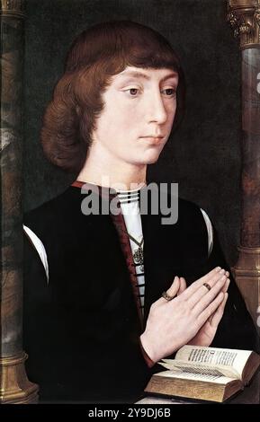 MEMLING, Hans (* ca. 1440, Seligenstadt, d. 1494, Brügge) junger Mann am Gebet um 1475 Eiche, 38,7 x 25,4 cm National Gallery, London das Gemälde war wahrscheinlich die linke Tafel eines Triptychons, wobei die mittlere Tafel (wahrscheinlich eine Jungfrau und ein Kind) und die rechte Tafel (wahrscheinlich das Porträt einer Frau) verloren gingen. Andere gingen davon aus, dass es sich um das linke Panel eines Diptychons handelt, das dem Diptychon Nieuwenhove ähnelt. --- Schlüsselwörter: ----------------- Autor: MEMLING, Hans Titel: Junger Mann im Gebet Zeitlinie: 1451-1500 Schule: Flämische Form: Malerei Typ: Porträt Stockfoto