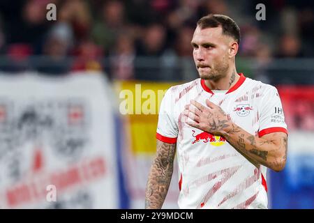 Leipzig, Deutschland. Oktober 2024. Fußball: Champions League, RB Leipzig - Juventus Turin, Vorrunde, Spieltag 2 in der Red Bull Arena. Der Leipziger Spieler David Raum reagiert. Quelle: Jan Woitas/dpa/Alamy Live News Stockfoto