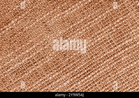 Orangefarbener Polsterung mit Jacquard-Diagonalgewebe und grober Webstruktur. Textilhintergrund, Möbel Textilmaterial, Tapete, Hintergrund. Stoffstru Stockfoto