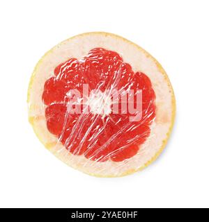 Hälfte der Grapefruit mit Plastikfolie isoliert auf weiß, Draufsicht Stockfoto