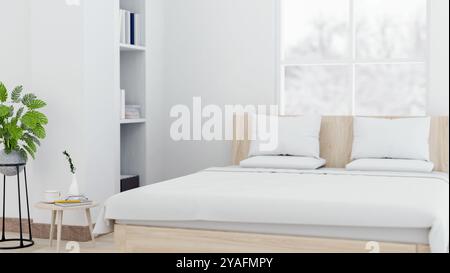 Die Inneneinrichtung eines modernen, minimalistischen Schlafzimmers verfügt über ein komfortables Bett mit weißen Bettlaken, eine Zimmerpflanze, eine weiße Wand und einen Schneewahn Stockfoto