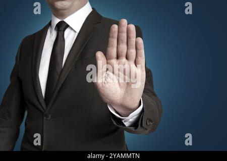 Hand Stop wird vom Geschäftsmann gezeigt Stockfoto