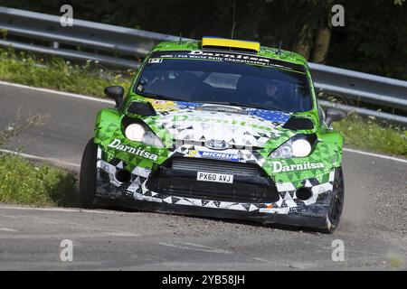 Yuriy Protasov und Pavlo Cherepin treten am 2. Tag der ADAC-Rallye Deutschland am 23. August 2014 in Trier in ihrem Ford Fiesta RS WRC an Stockfoto