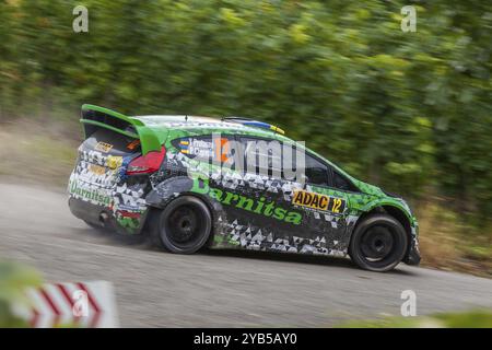 Yuriy Protasov und Pavlo Cherepin treten am 1. Tag der ADAC Rallye Deutschland am 22. August 2014 in Trier in ihrem Ford Fiesta RS WRC an Stockfoto