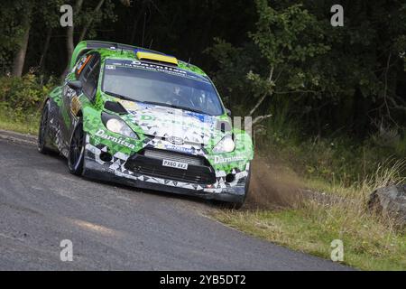 Yuriy Protasov und Pavlo Cherepin treten am 2. Tag der ADAC-Rallye Deutschland am 23. August 2014 in Trier in ihrem Ford Fiesta RS WRC an Stockfoto